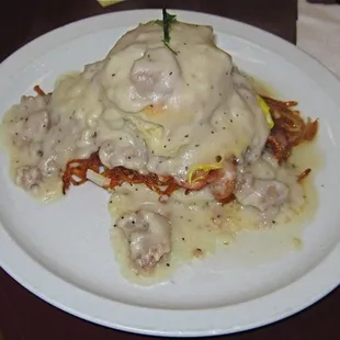 The Volcano, hash browns, biscuit, fried egg, breakfast meat of choice and biscuit all covered in sausage gravy
