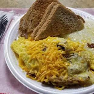 Omelette with grilled chicken  bacon and cheese. Rye toast  and grits. Wow!