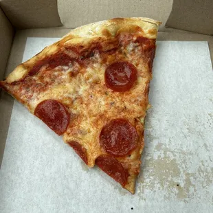 a slice of pepperoni pizza