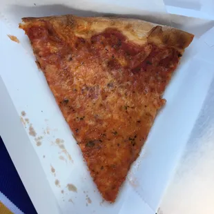 a slice of pizza in a box