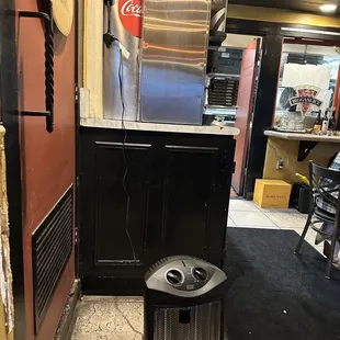 a trash can in the kitchen