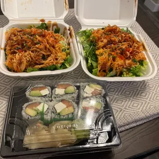 two take out containers of food