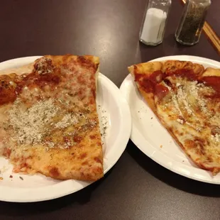 two slices of pizza on plates