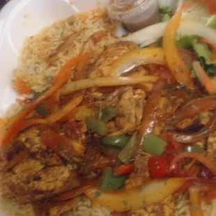 chicken suqaar with saffron rice and a side salad