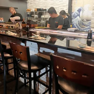 two men working behind the counter