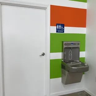 Filtered water station, Gender neutral restrooms, and in this area is a nice clean changing station for those in diapers.