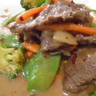 Thai peanut sauce stir fry with beef, close-up.