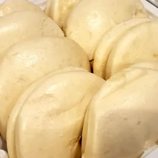 a close up of a tray of doughnuts