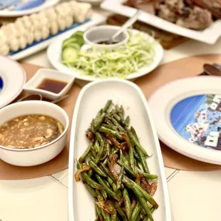 a variety of dishes of food on a table