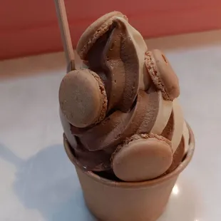 Soft Serve Swirl - Vanilla Bean Macaron and Seasonal Frozen Hot Chocolate topped with mini waffle cone macarons