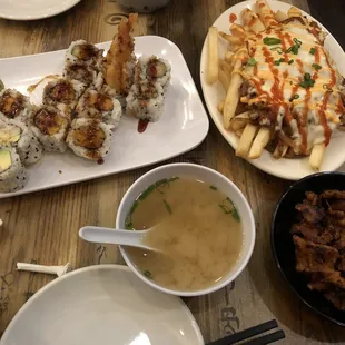 Korean Loaded Fries, Shrimp Tempura Roll, Sweet Potato Roll, and Spicy California Roll