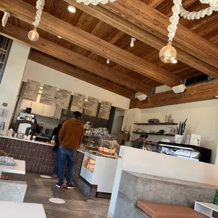 a man standing in a coffee shop