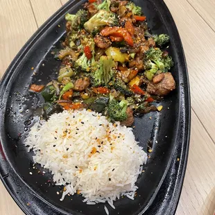 a plate of rice and vegetables