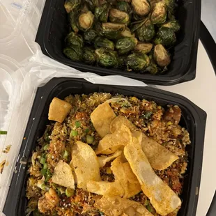 two take out containers of food