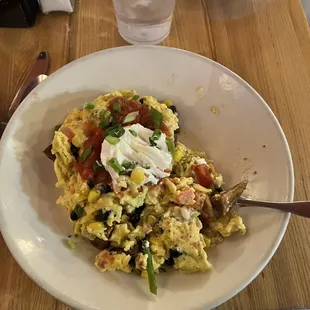 a bowl of scrambled eggs and vegetables