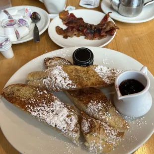 French toast with berry compote and a little jar of real maple syrup. (100% maple syrup is an upcharge of $1.95). Also, delicious bacon.