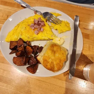 Ham and cheese omelette with biscuit and potatoes