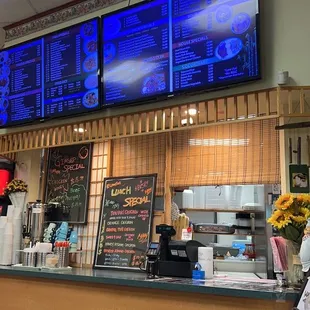 a restaurant counter and menus