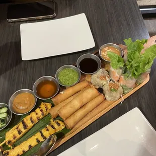 Sampler 19: chicken satay, dumplings, cheese rolls, soft spring rolls, crispy rolls