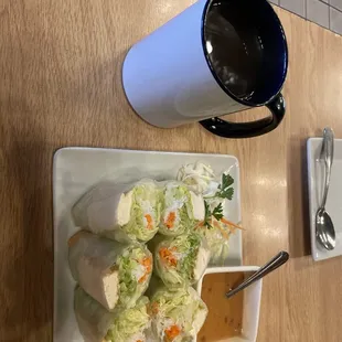 a plate of food and a cup of coffee