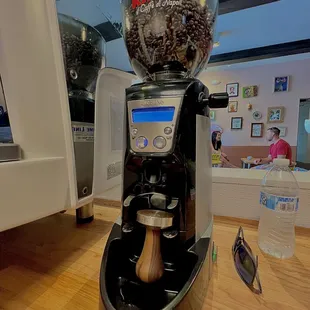 a coffee machine with a coffee grinder