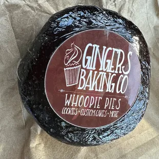 a chocolate cake with a cupcake on top