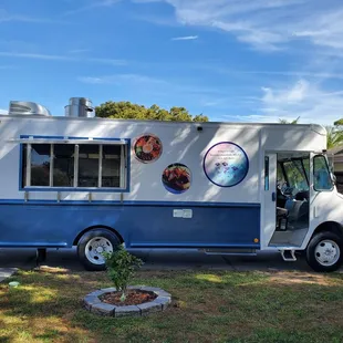 a blue and white food truck