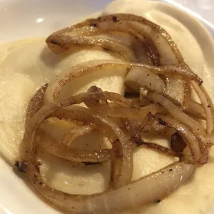 Side dish pirogies with butter and onions