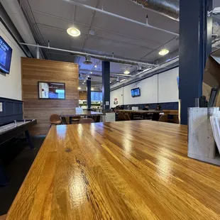 a large wooden table in a restaurant