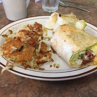 Bacon avocado burrito with hash browns