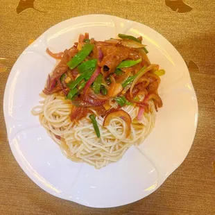 Chengdu style stir fried noodles topped with scallion beef