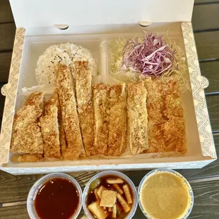 Katsu box: Rice, hand-breaded katsu (pork, chicken, fish), cabbage salad with housemade dressing, katsu dipping sauce, pickled veggies