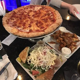 Pizza, hot wings, and antipasto salad