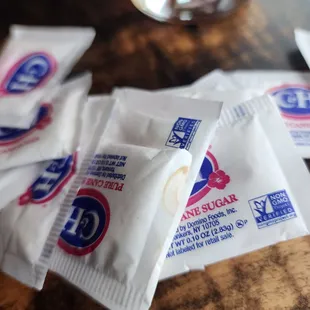 Stains on the sugar packets. Which means it had already been to someone else&apos;s table.