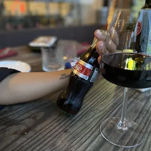 a woman holding a glass of wine