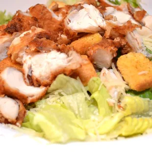 Caesar Salad w/ Fried Chicken pieces.