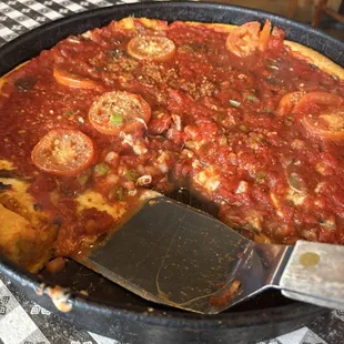 Large veggie deep dish bland tasting and watery runny sauce