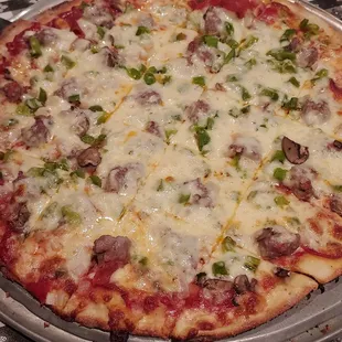 XL Thin crust pizza with everything on it but anchovies. The crust was perfect.
