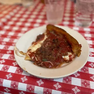 a slice of deep dish pizza