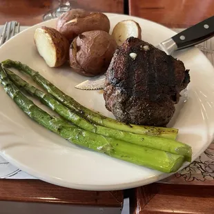 Eight ounce sirloin steak with Tuscan potatoes and asparagus.