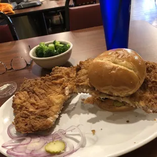 Pork tenderloin with a side of broccoli.