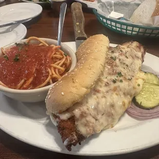 Italian Steak Parmigiana Sandwich with a side of spaghetti. Yum!