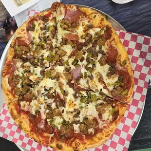 12" Italian stallion pizza. Beef ,sausage, pepperoni, Canadian bacon, and green chili