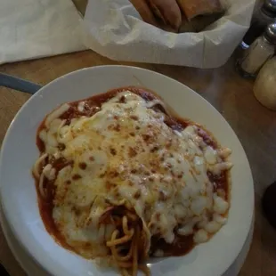Lunch special baked spaghetti with garlic bread