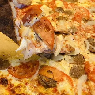 Vegetable toppings were cut huge, scant amounts of sausages and cheese, and barely any pizza sauce