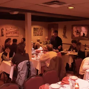 A server prepares Gino's famous house tableside Caesar Salad