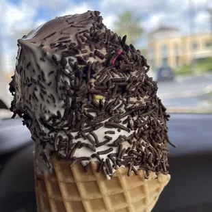 Large Chocolate vanilla swirl with chocolate sprinkles waffle cone.