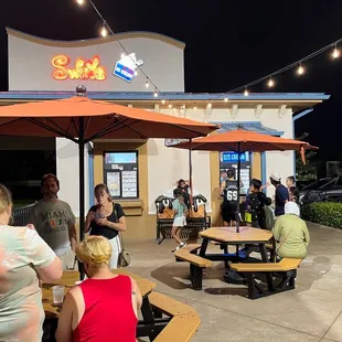 Outdoor seating and walk up window or drive through.