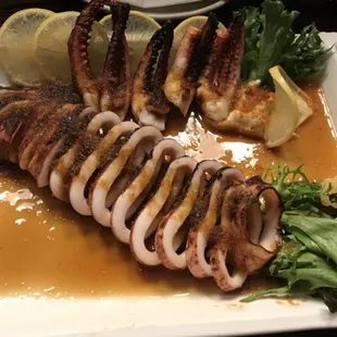 Whole grilled squid with Japanese Mayo and house ginger squid sauce. Ours great with Sake!