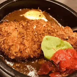 Baked Katsu curry rice. Japanese style curry with panko breaded pork cutlet and egg.